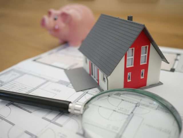 Person reviewing renovation budget and permit documentation