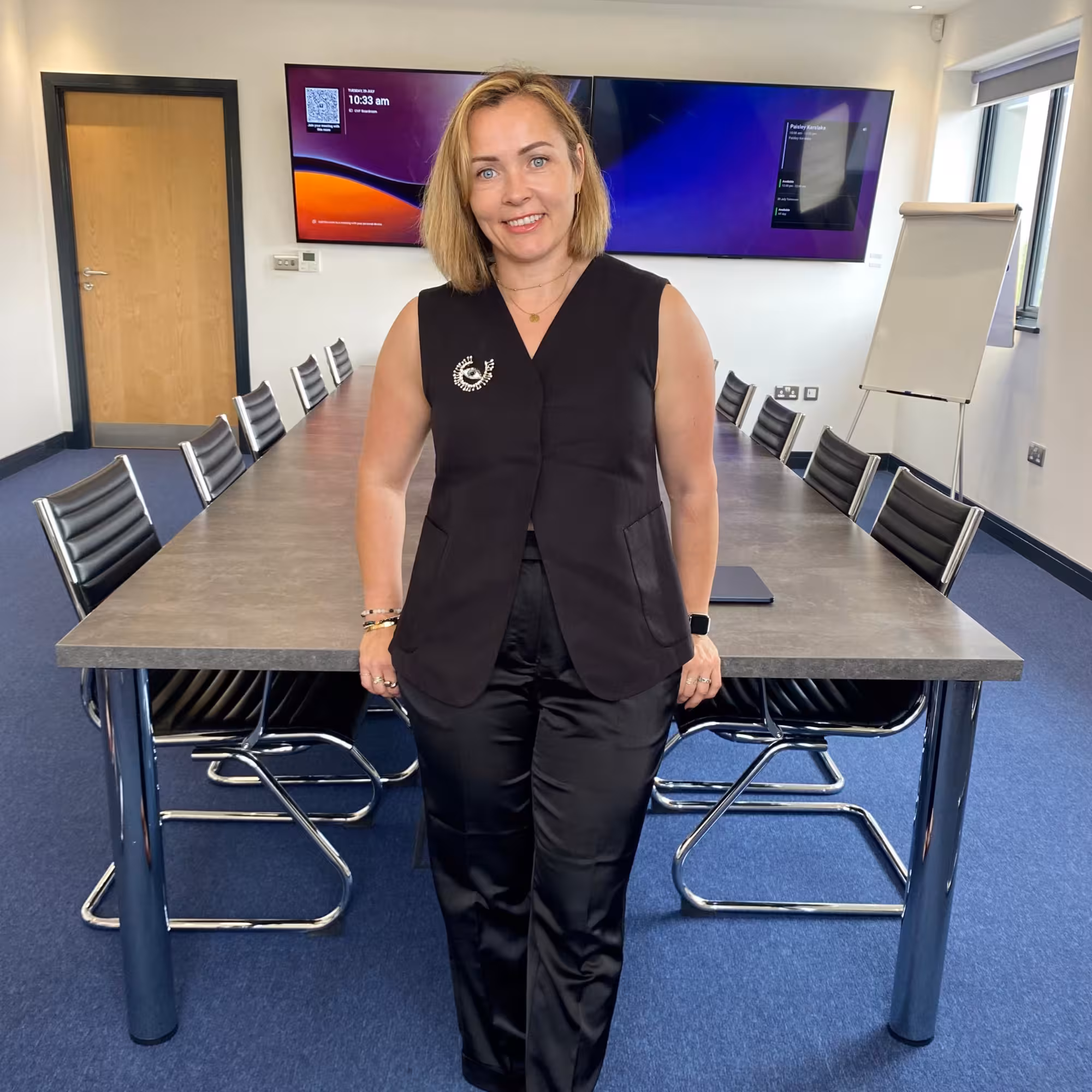 Snezana, founder of Archway Facilities, standing in the company’s office